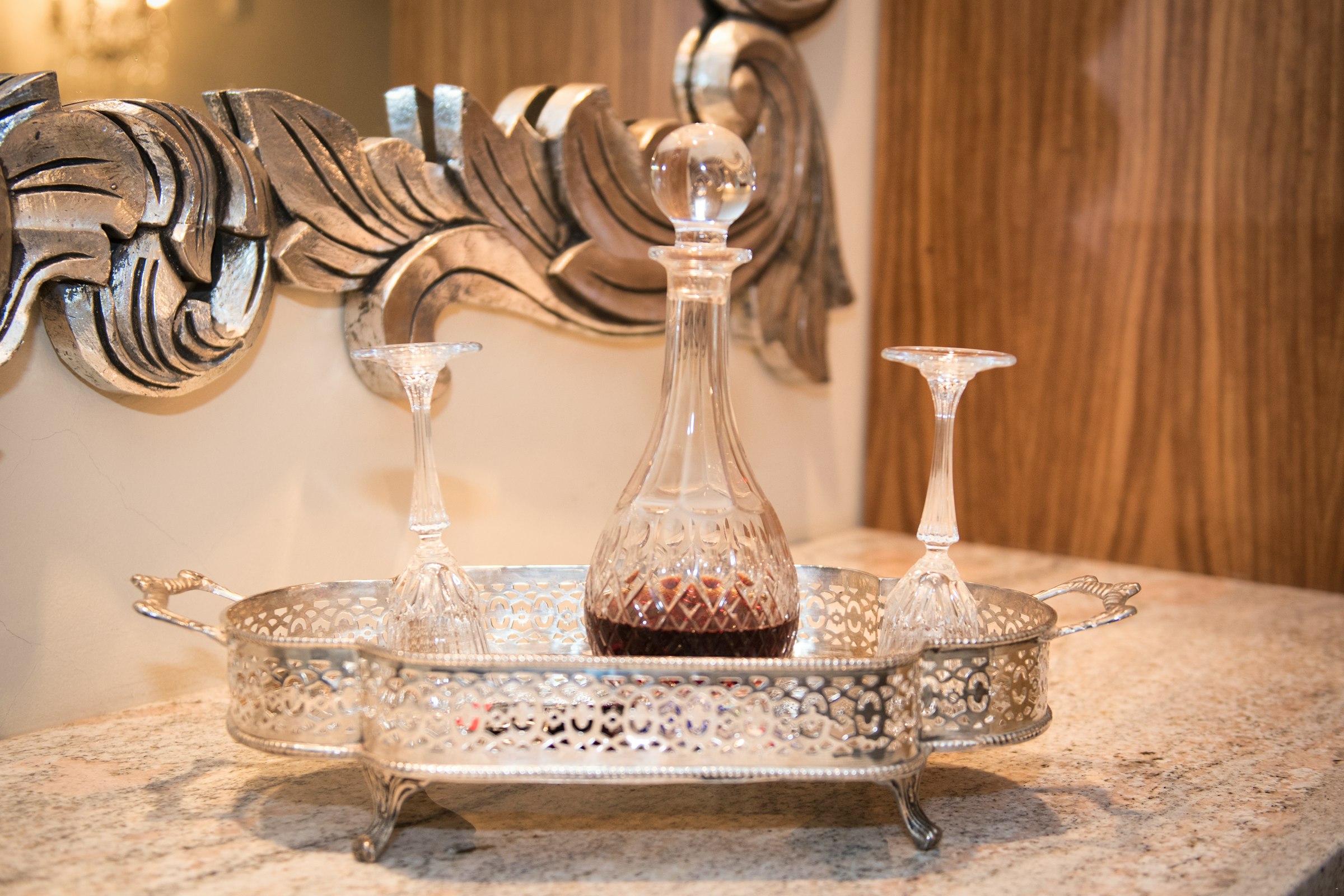 Silver tray with decanter and vintage details at Au Jardin Guesthouse