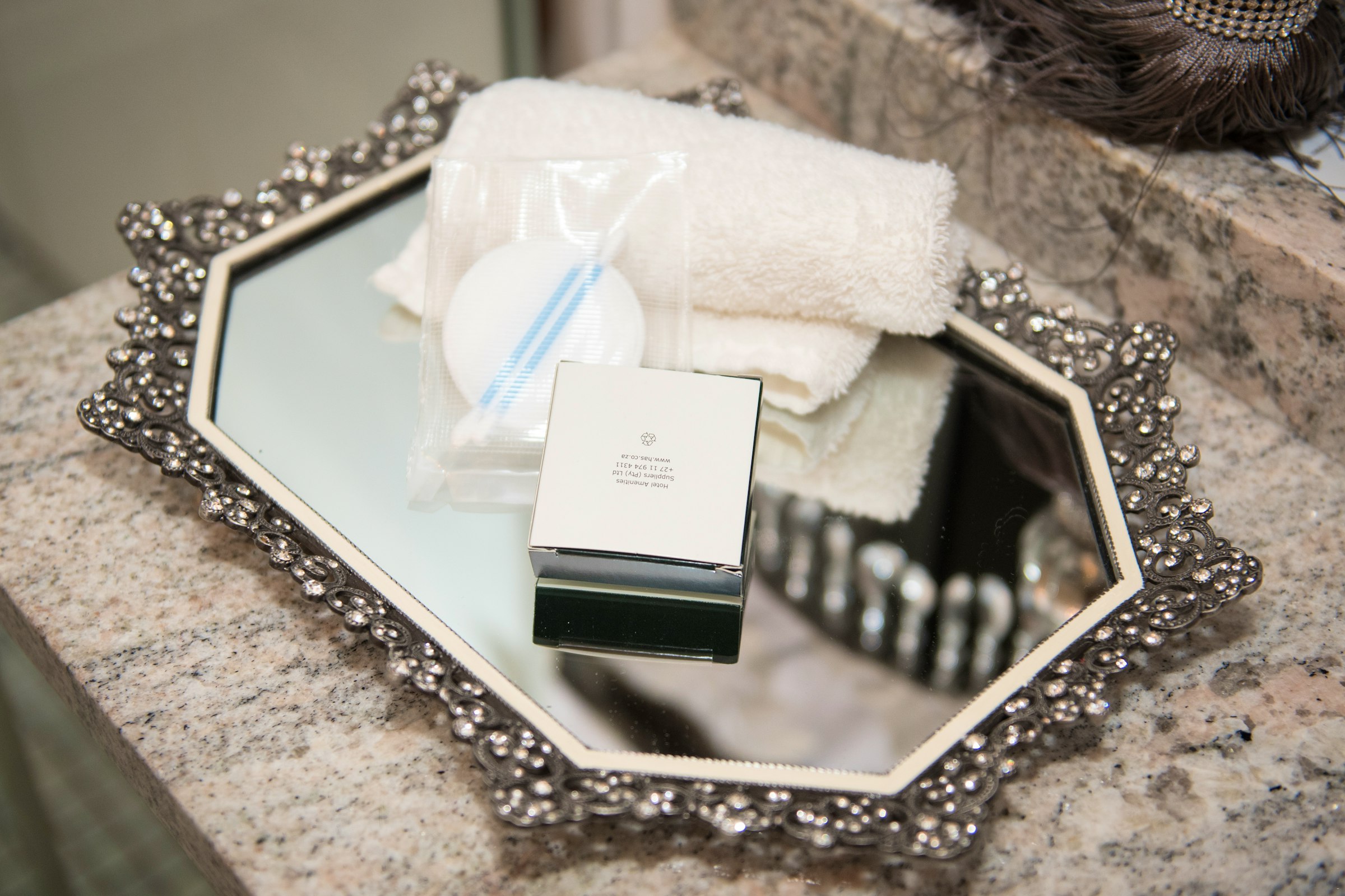 Plush towels and luxury soap prepared for guests at Au Jardin